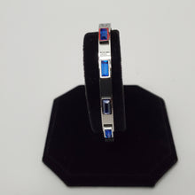 Load image into Gallery viewer, 18K WHITE GOLD PLATED STAINLESS STEEL BLUE STONE BANGLE
