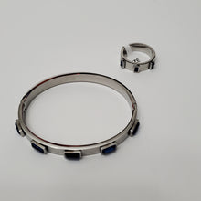 Load image into Gallery viewer, 18K WHITE GOLD PLATED STAINLESS STEEL BLUE STONE BANGLE
