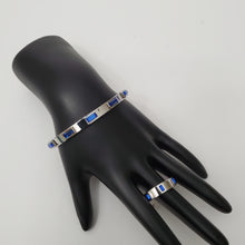 Load image into Gallery viewer, 18K WHITE GOLD PLATED STAINLESS STEEL BLUE STONE BANGLE
